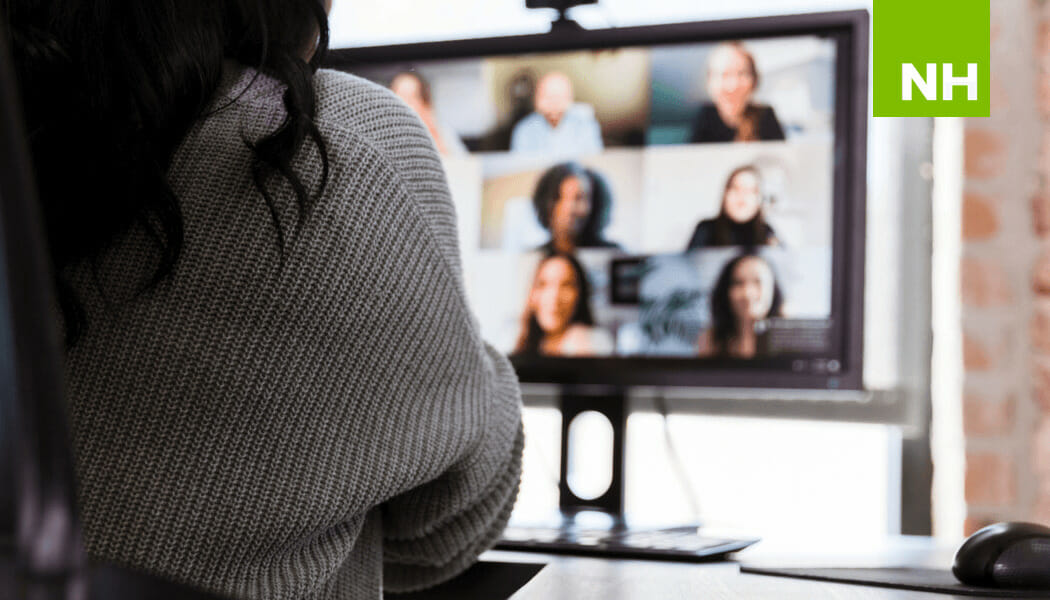 Woman looking at screen for team meeting