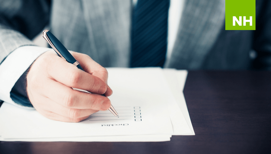 Business man writing checklist for nonprofit financial management